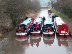 4 Boats moored alongside.