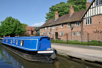 Cruising the canal boat through a pretty village