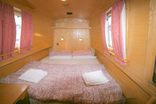 The double bed on board the canal boat.
