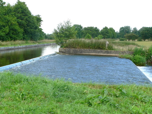 Excess water goes down the weir to bypass the lock